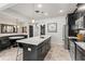 Contemporary kitchen with sleek cabinetry, stainless steel appliances, and a spacious island at 10460 Burrows St, Orlando, FL 32832