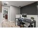 Stylish home office with shiplap walls, modern desk, and ample workspace at 10460 Burrows St, Orlando, FL 32832