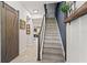 Staircase leading to the second floor, featuring stylish wood treads and a dark blue accent wall at 10460 Burrows St, Orlando, FL 32832