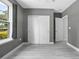 Simple bedroom with gray walls, a closet, and a window at 1094 Lolita St, Orange City, FL 32763