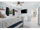 Bedroom with a white bed, dark curtains, and decorated wall shelves at 1094 Lolita St, Orange City, FL 32763