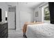 Bedroom with gray walls, a white bed, and a closet at 1094 Lolita St, Orange City, FL 32763