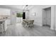 Dining area features a wooden table, bench seating, and sliding glass doors to the backyard at 1094 Lolita St, Orange City, FL 32763