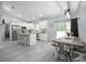 Open-concept kitchen and dining area with modern finishes and natural light at 1094 Lolita St, Orange City, FL 32763