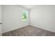 Small bedroom featuring one window and neutral carpet at 1161 Kenway Ave, Deltona, FL 32738