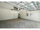 Spacious garage with bare ceiling, white walls, and concrete flooring; plenty of room for parking and storage at 1161 Kenway Ave, Deltona, FL 32738