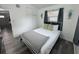 Bedroom with gray wood floors, large window, and modern decor at 1215 N Boston Ave, Deland, FL 32724