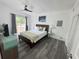 Bedroom featuring sliding glass doors to patio and ceiling fan at 1215 N Boston Ave, Deland, FL 32724