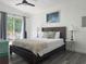 Bedroom featuring sliding glass doors to patio and ceiling fan at 1215 N Boston Ave, Deland, FL 32724