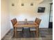 Inviting dining room features a wood table, seating for four, and a neutral-toned rug at 1215 N Boston Ave, Deland, FL 32724