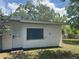 Exterior view of home includes white door and window at 1215 N Boston Ave, Deland, FL 32724