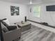 Cozy living room featuring comfortable seating, modern decor, and natural light at 1215 N Boston Ave, Deland, FL 32724