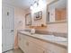 Bathroom with double sinks, large vanity, and framed mirrors at 122 Cedar Dunes Dr, New Smyrna Beach, FL 32169