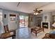 Open concept living room features tile floors and sliding glass doors opening to a private outdoor patio at 122 Cedar Dunes Dr, New Smyrna Beach, FL 32169