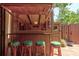 The Tiki bar in the patio is decorated with vibrant stools, bamboo accents, and island decor at 122 Cedar Dunes Dr, New Smyrna Beach, FL 32169