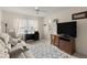 Cozy bedroom with a ceiling fan, comfortable seating, and a workspace with a black desk at 123 Wood Ibis Ct, Daytona Beach, FL 32119