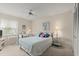 Cozy bedroom with a ceiling fan, a window with natural light, a desk area, and comfortable, inviting decor at 123 Wood Ibis Ct, Daytona Beach, FL 32119