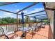 Outdoor patio with tables and umbrellas, offering a relaxing space for community residents to gather at 123 Wood Ibis Ct, Daytona Beach, FL 32119