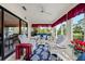 Bright sunroom with comfortable seating, an area rug, and views of the outdoors at 123 Wood Ibis Ct, Daytona Beach, FL 32119