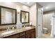 Well-lit bathroom featuring a double vanity with granite countertops and updated fixtures at 1261 Burning Tree Ln, Winter Park, FL 32792