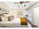 Bright bedroom with a comfortable bed, stylish decor, and natural light at 1261 Burning Tree Ln, Winter Park, FL 32792