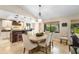 Charming dining area with a round table, comfortable chairs, and a seamless connection to the kitchen at 1261 Burning Tree Ln, Winter Park, FL 32792