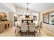 Bright dining area adjacent to an updated kitchen and with travertine floors at 1261 Burning Tree Ln, Winter Park, FL 32792