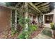 Front entrance to home with vine covered pergola at 1261 Burning Tree Ln, Winter Park, FL 32792