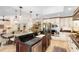 Spacious kitchen with stainless steel appliances and island open to the living area at 1261 Burning Tree Ln, Winter Park, FL 32792
