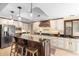 Stylish kitchen with island and seating, granite countertops, and stainless appliances at 1261 Burning Tree Ln, Winter Park, FL 32792