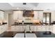 Modern kitchen with white cabinets, dark countertops, and updated appliances at 1261 Burning Tree Ln, Winter Park, FL 32792