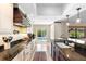 Open-concept kitchen with pool view, featuring an island and modern appliances at 1261 Burning Tree Ln, Winter Park, FL 32792