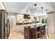 Beautiful kitchen featuring dark countertops, an island, and pendant lighting at 1261 Burning Tree Ln, Winter Park, FL 32792