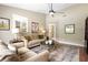 Inviting living room features stylish décor, a cozy seating area, and a ceiling fan for added comfort at 1261 Burning Tree Ln, Winter Park, FL 32792
