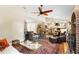 Spacious living room featuring hardwood floors, fireplace, and open layout at 1261 Burning Tree Ln, Winter Park, FL 32792