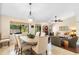 Cozy living space featuring a dining area with a round table, comfortable seating, and a view of the outdoors at 1261 Burning Tree Ln, Winter Park, FL 32792