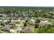 Aerial view of a residential neighborhood with homes surrounding a scenic lake at 1314 Lake Baton Dr, Deltona, FL 32725