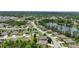 Scenic aerial perspective featuring homes nestled along a peaceful lake in a suburban neighborhood at 1314 Lake Baton Dr, Deltona, FL 32725