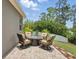 Outdoor seating area features a cozy fire pit and comfortable swivel chairs at 1314 Lake Baton Dr, Deltona, FL 32725