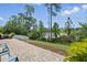 A brick patio features comfortable seating and a lake view at 1314 Lake Baton Dr, Deltona, FL 32725