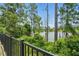 Relaxing backyard view overlooking lush greenery and serene lake view at 1314 Lake Baton Dr, Deltona, FL 32725