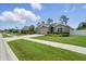 Lovely home with a three-car garage, stone accents, and a well-manicured lawn at 1314 Lake Baton Dr, Deltona, FL 32725