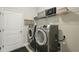 Well-equipped laundry room with modern washer and dryer at 1314 Lake Baton Dr, Deltona, FL 32725
