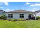 View of the backyard with a garden in the back at 1323 Donatello Ln, Winter Haven, FL 33884