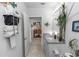 Bathroom view with a sink, mirror and a door leading to a room with a wooden cabinet at 1323 Donatello Ln, Winter Haven, FL 33884