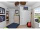 A bright bedroom with a ceiling fan, closet and a fitness ball by the window at 1323 Donatello Ln, Winter Haven, FL 33884