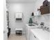 The laundry room features a side by side washer and dryer and a 