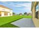 This backyard has green grass and a concrete patio, offering a comfortable outdoor space at 136 Columbia Dr, Kissimmee, FL 34759