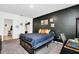 Comfortable bedroom with a dark accent wall, carpeted floors, and a view of the closet at 136 Columbia Dr, Kissimmee, FL 34759