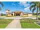 The community clubhouse offers a welcoming entrance with manicured landscaping at 136 Columbia Dr, Kissimmee, FL 34759